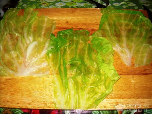 Рецепт Колбаски (или сосиски) в капустных листьях фото