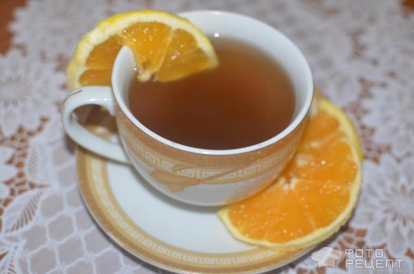 Согревающий напиток из апельсиновой кожуры и корицы фото