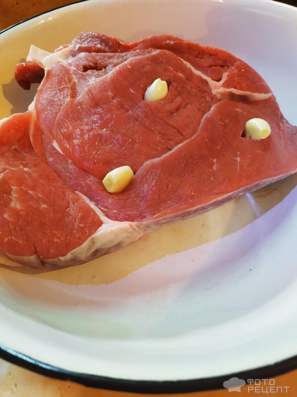 Мясо тушеное с чесноком фото