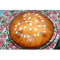 Фото Пышный пирог с глазурью и декоративной кондитерской посыпкой